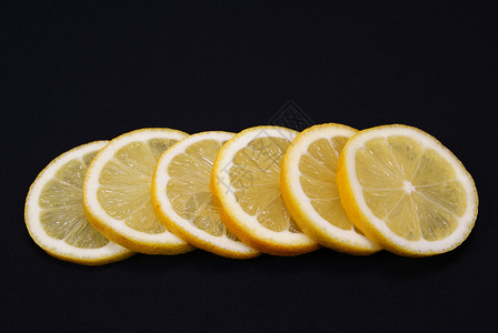 柠檬黄色水果圆形黑色背景图片