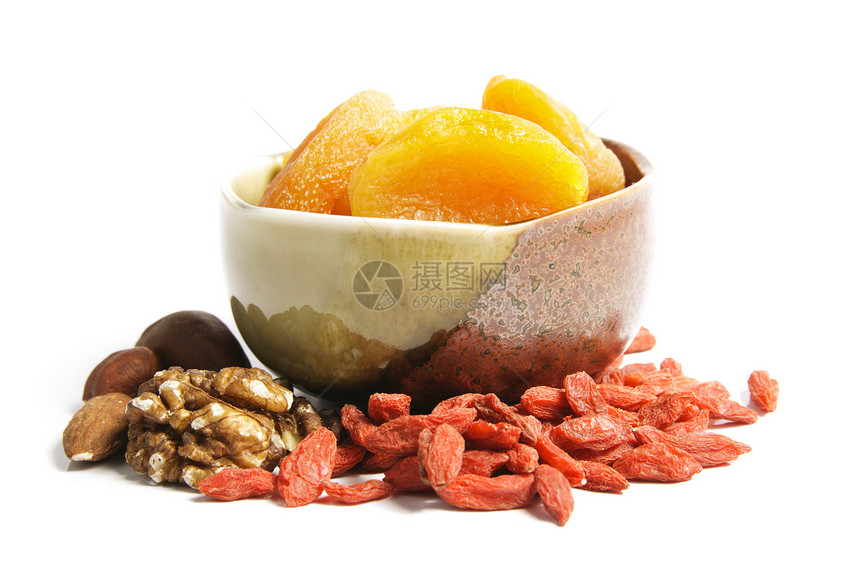 碗中干燥的杏仁纤维团体坚果水果饮食甜点橙子小吃植物收成图片