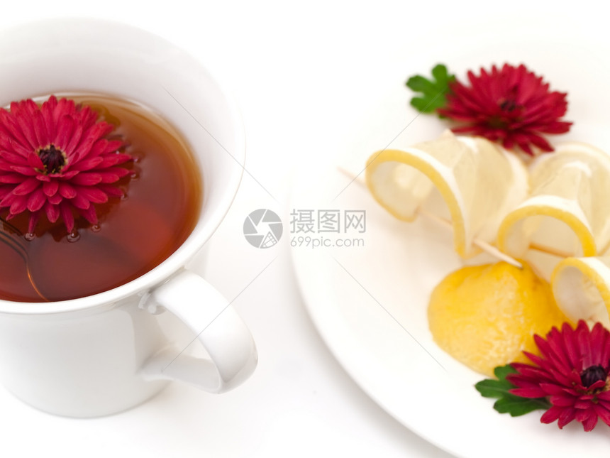 茶 柠檬和鲜花图片
