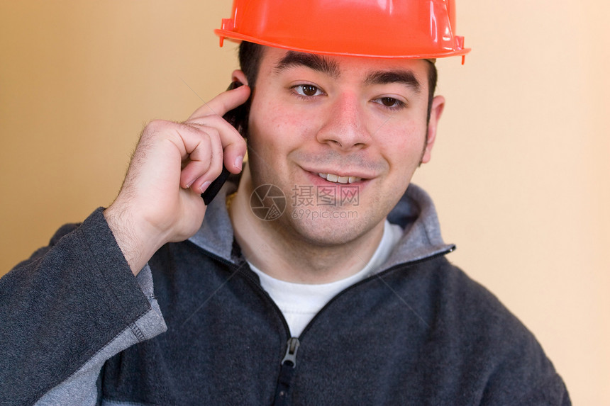 建筑工人劳动者安全工程师橙子男人商务检查员细胞手机老板图片