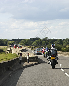 摩托车手汽车皮衣经济文件自行车地标头盔乡村运输纪念碑背景图片