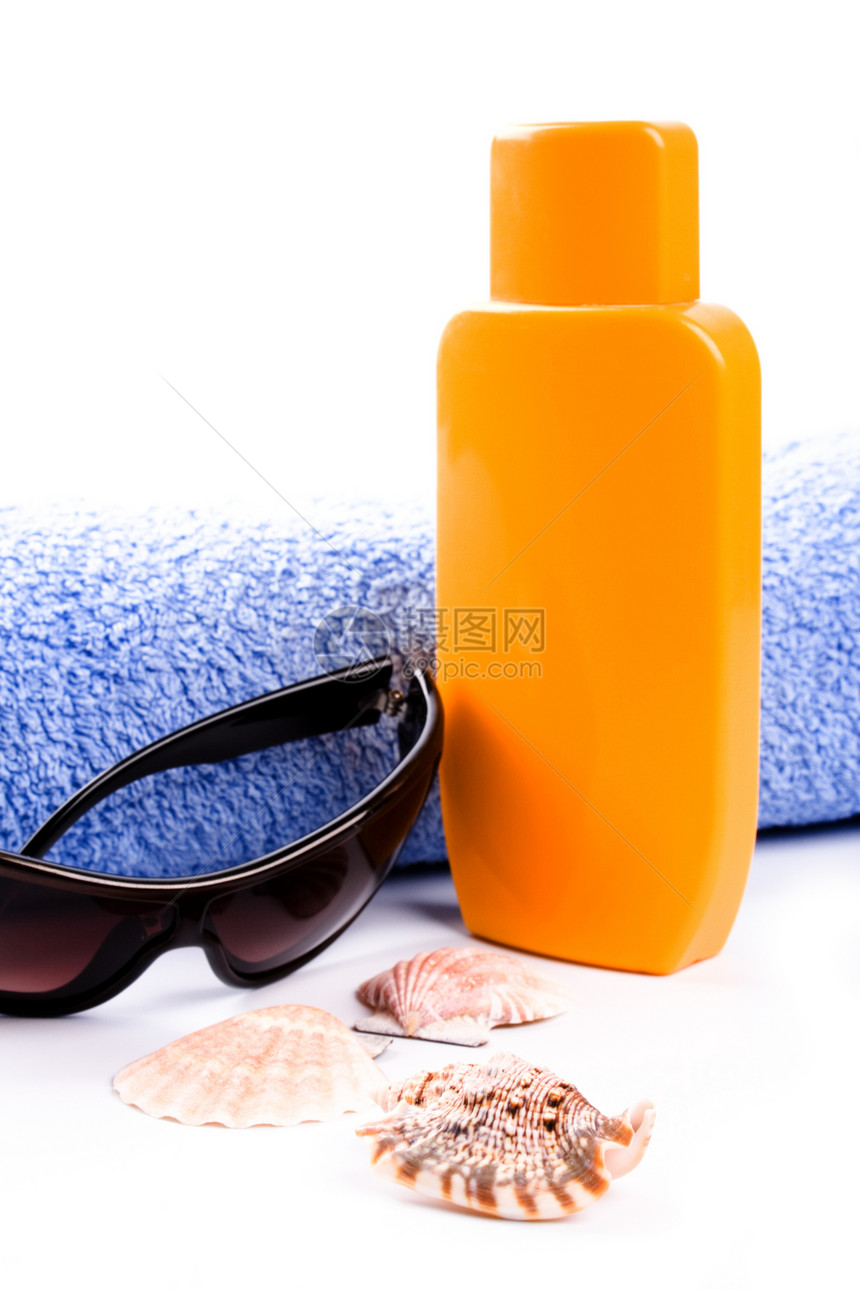 毛巾 贝壳 太阳镜和润滑剂奶油海洋太阳洗剂黄色化妆品蓝色白色丁字裤棕色图片