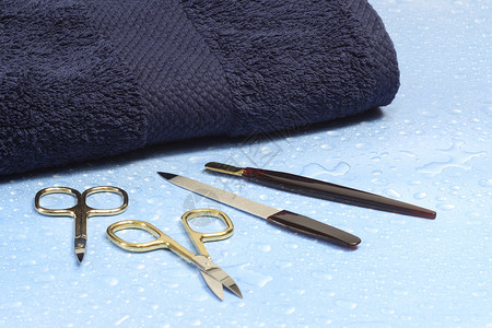 刺耳修指甲剪刀毛巾金属护理去角质保养足疗锉刀化妆品背景