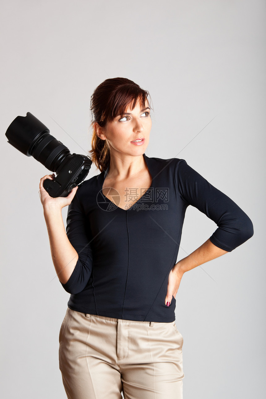女摄影师爱好工作相机黑发女性技术单反工作室成人女孩图片