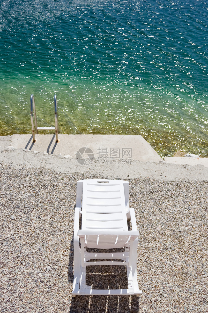 海滩椅假期旅游支撑天空海洋石头享受异国叶子环境图片