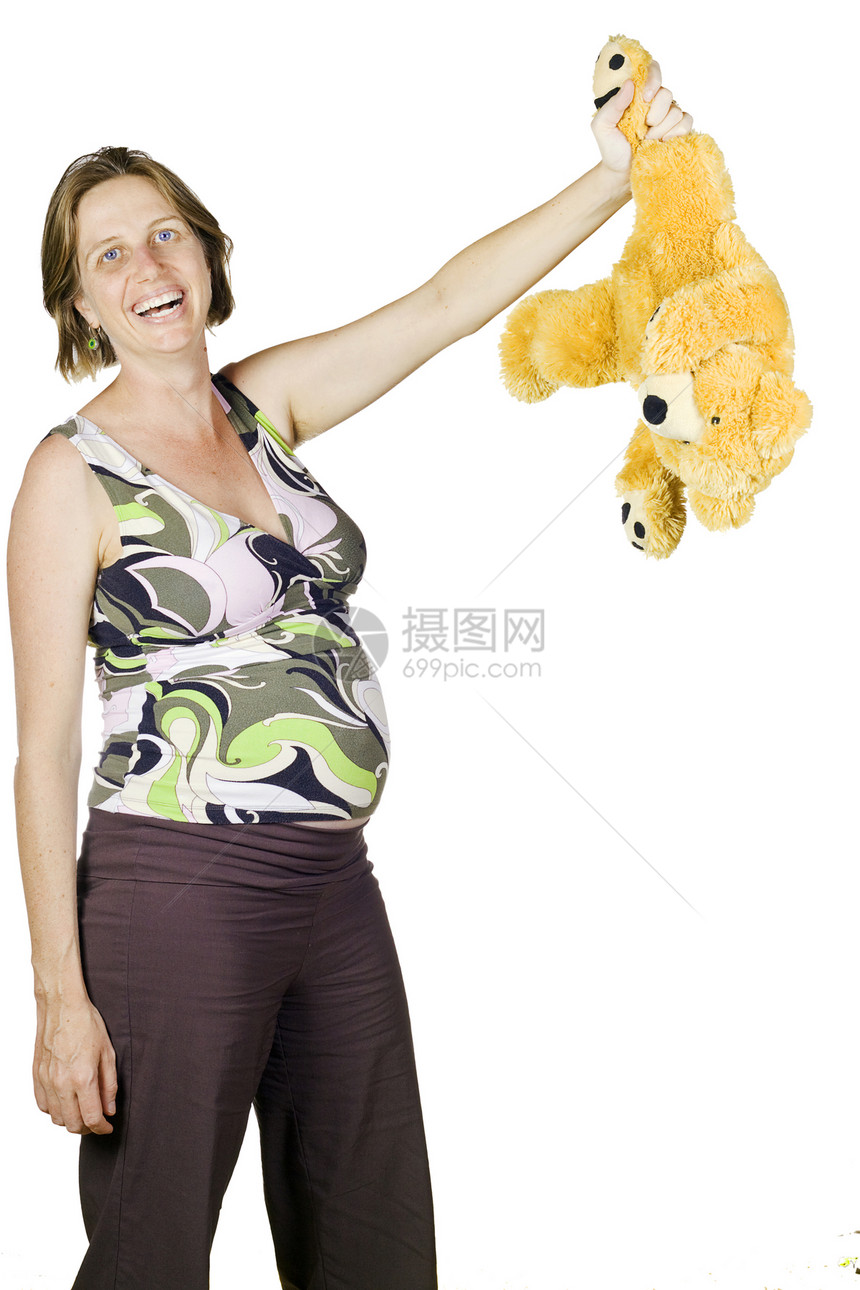 孕妇笑着拿着泰迪Teddy的有趣肖像图片