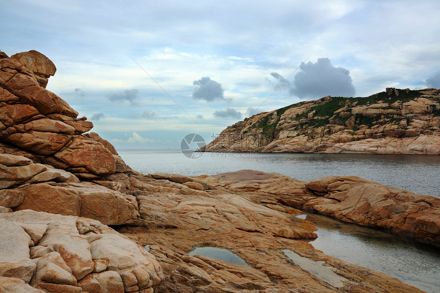 沿海海岸日落蓝色海岸线天气假期太阳热带旅行阳光橙子图片