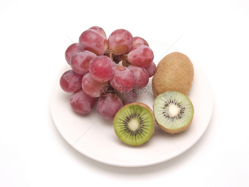 Kiwi和葡萄盘子红色紫色绿色种子奇异果果汁热带白色水果图片