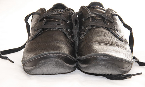 深色皮鞋配饰男士棕色女性鞋带黑色衣服鞋类白色时尚背景图片