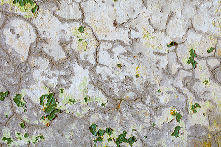 旧石膏上绿色涂料的裂缝和斑点高清图片
