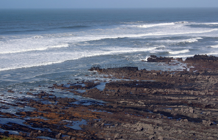 岩石海岸线峭壁波浪海洋假期太阳地平线海景海滩石头支撑图片