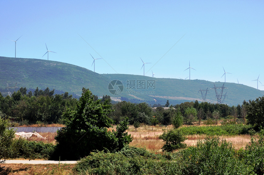 风力发电机的风景蓝色生态微风天气技术涡轮机电气公园涡轮图片