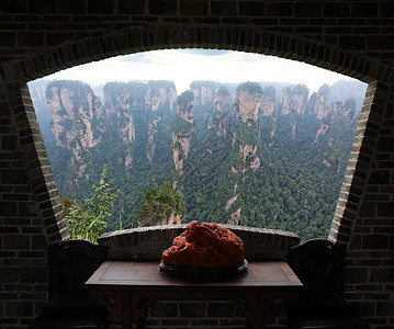 中国的张积洁国家公园柱子树木山谷天空公园窗户国家绿色框架丘陵图片
