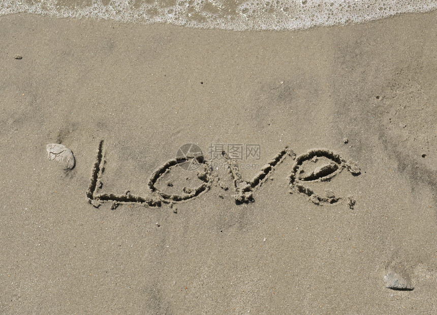 爱在沙沙中与海浪一起写作岩石贝壳泡沫海滩海洋电子图片