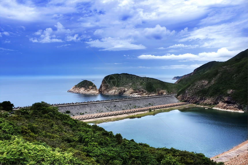 横向景观岩石支撑蓝色沿海太阳阳光日光天空海岸情调图片