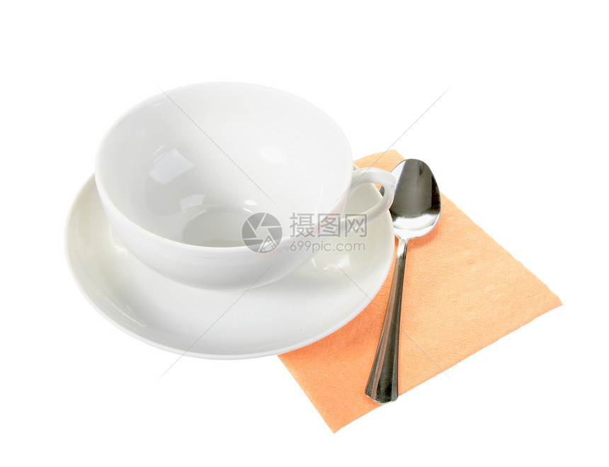 白空杯子和橙色纸巾纸上的勺子图片