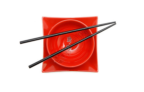 红日日日碗和平板顶视图上的黑筷子背景图片