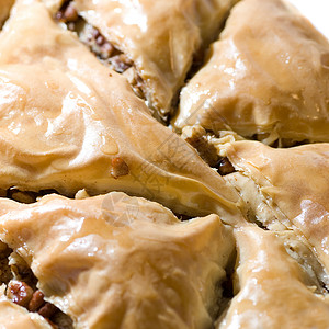 巴克拉瓦的托赖糕点甜点核桃正方形棕色坚果食物片状照片背景图片