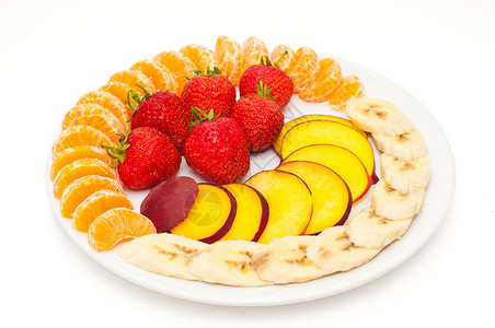 盘子上的水果甜点低脂肪橘子沙拉健康维生素早餐桃子小吃香蕉背景图片