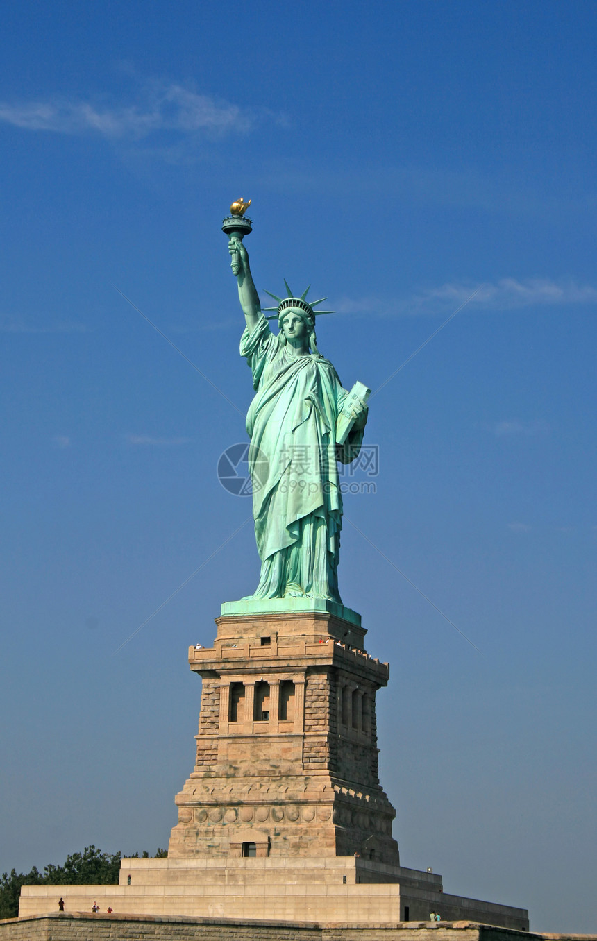 自由女神像吸引力旅游蓝色雕像天空公园港口女士建筑学旗帜图片