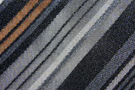 组织质体领带条纹灰色黑色丝绸织物白色棕色背景图片