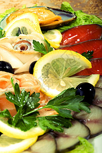 软骨鱼带海鲜的饭菜沙拉餐厅晚餐鱼片烹饪菜单盘子牡蛎香菜贝类背景