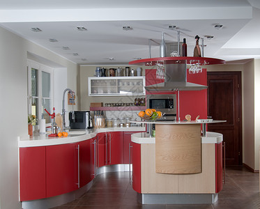 红色橱柜红色现代现代厨房奢华窗户火炉烤箱台面建筑学烹饪微波花岗岩房子背景