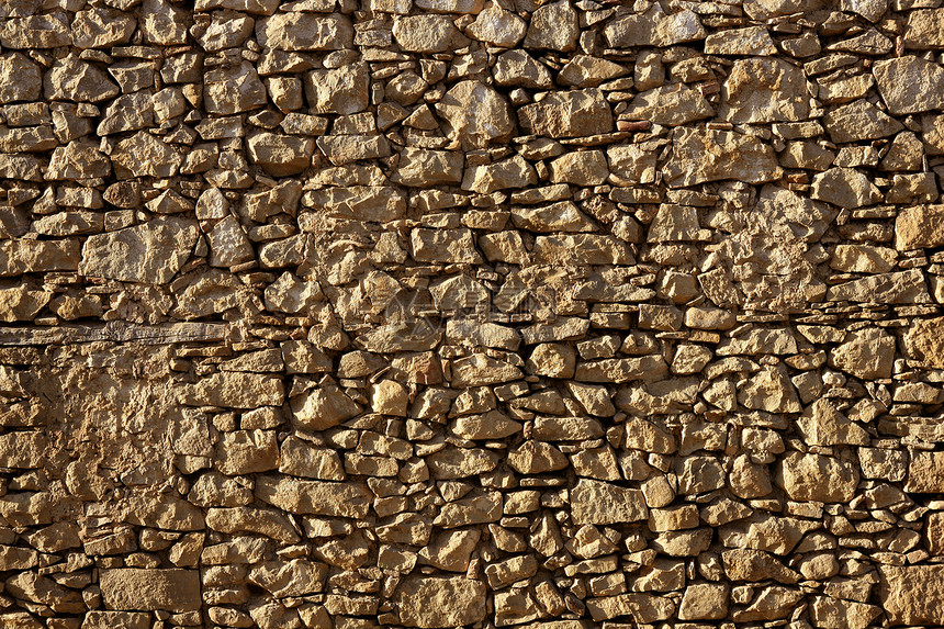 西班牙的共济会 旧石墙古董材料墙纸石工水泥砂浆房子城堡城市石头图片