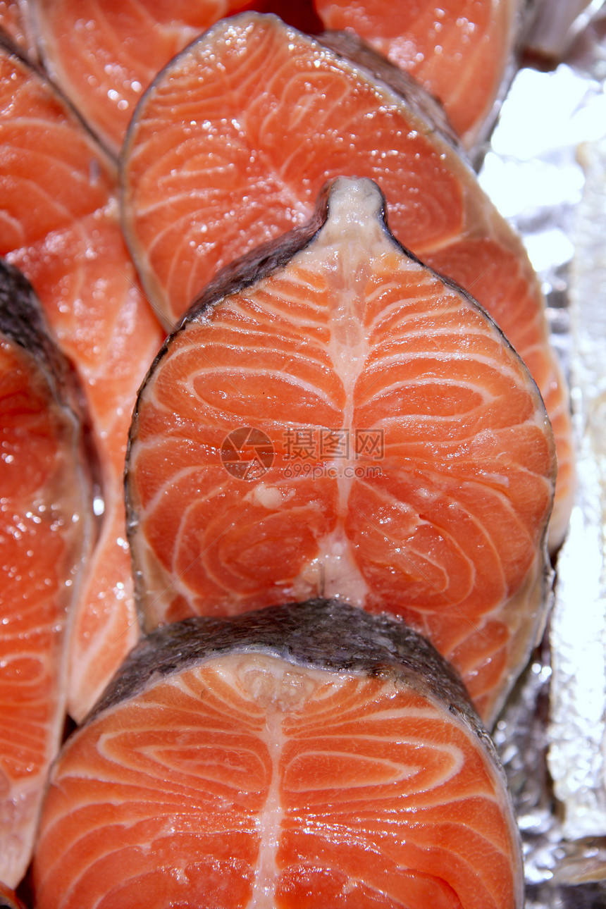 鲑鱼连续切片橙子鱼片餐厅海洋午餐寿司烹饪食物紫色营养图片