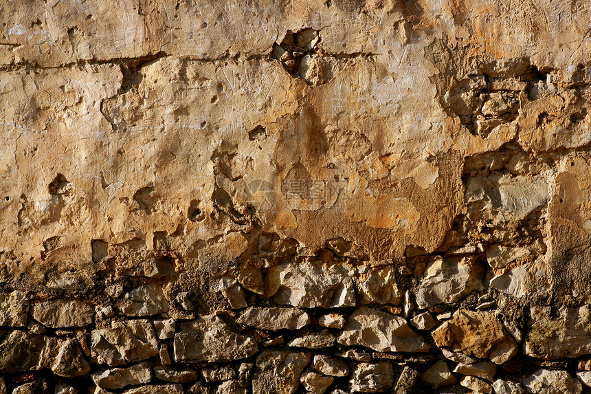 西班牙的共济会 旧石墙裂缝房子岩石砂浆古董材料墙纸城市石头建筑学图片