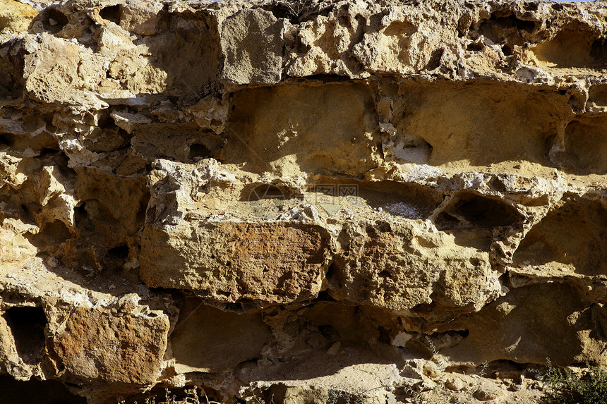西班牙的石墙 石墙和泥瓦乡村水泥橙子材料积木城市石头纹理黏土墙纸图片