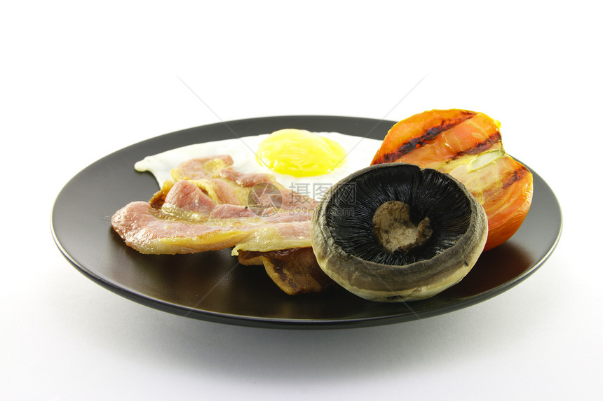 早餐在黑盘上平底锅味道食物英语油炸烹饪盘子猪肉脂肪带子图片