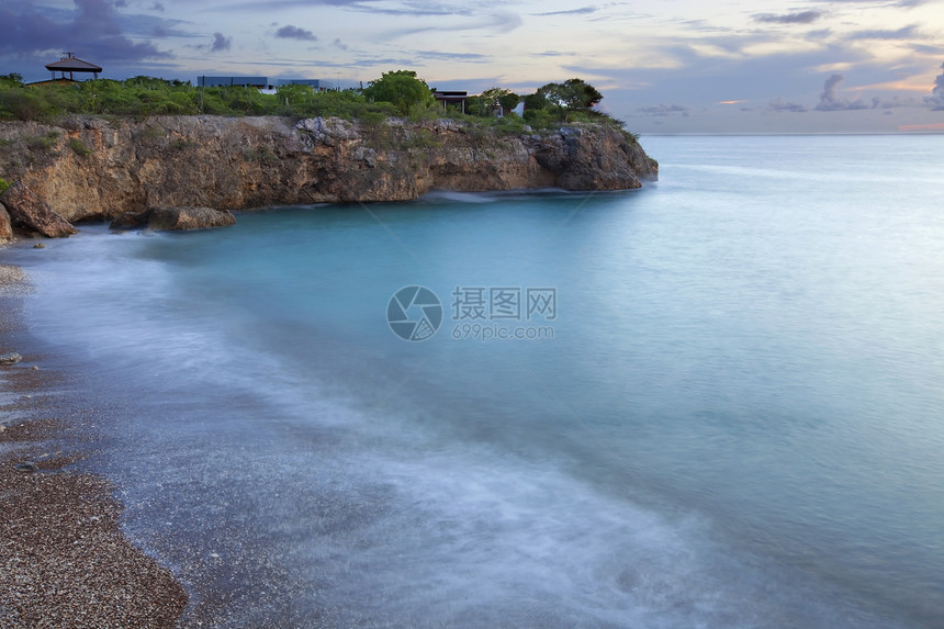 库拉索岛日落波浪蓝色海湾热带支撑悬崖海滩天空风景天堂图片
