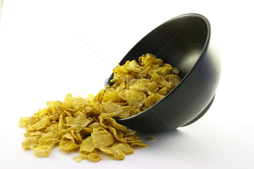 玉米片从碗里滚出来活力早餐白色粮食薄片谷物玉米营养食物产品图片