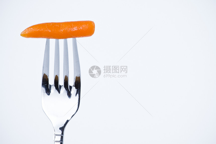 叉口中胡萝卜咬饮食白色营养绿色食品蔬菜美食食物维生素健康图片