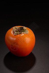 Persimmon 双环西蒙橙子柿子水果健康水平沙龙卡其色静物背景图片