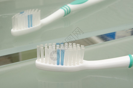 牙刷口服薄荷塑料空腔蓝色白色牙医绿色衰变浴室背景图片