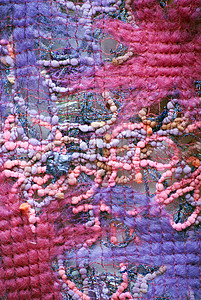 色彩多彩的材料布料羊毛紫色纺织品粉色背景图片