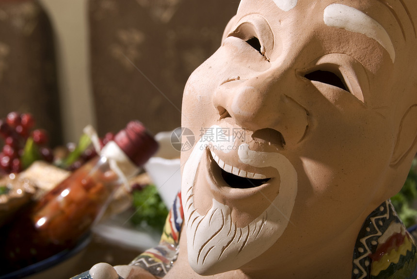 陶瓷雕像微笑艺术黏土制品褐色男人装饰品文化面具图片