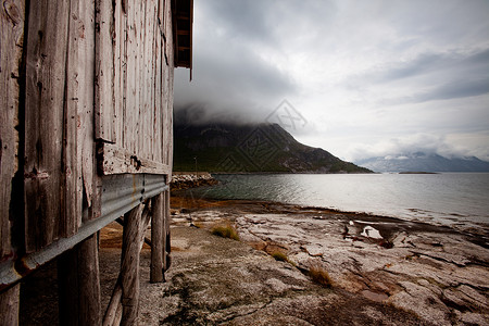 挪威海岸支撑小屋天气戏剧性石头海洋风暴岩石钓鱼建筑高清图片