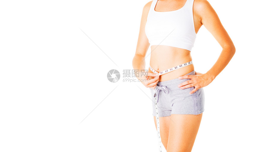 衡量自己白白度日的年轻妇女女性女士火车健身房娱乐磁带女孩减肥腰部肚子图片