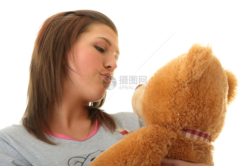 带着泰迪熊的漂亮少年女性快乐喜悦女孩幸福青年动物玩具女士拥抱图片