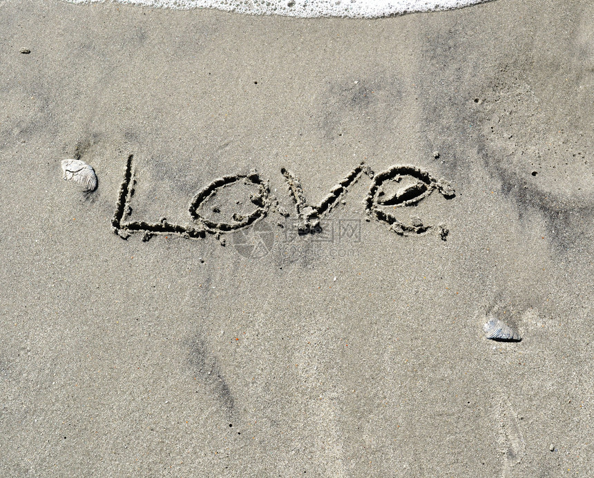 爱在沙沙中写作棕褐色泡沫海浪海洋图片