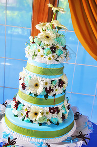 婚礼蛋糕庆典摄影花朵雏菊蓝色背景图片