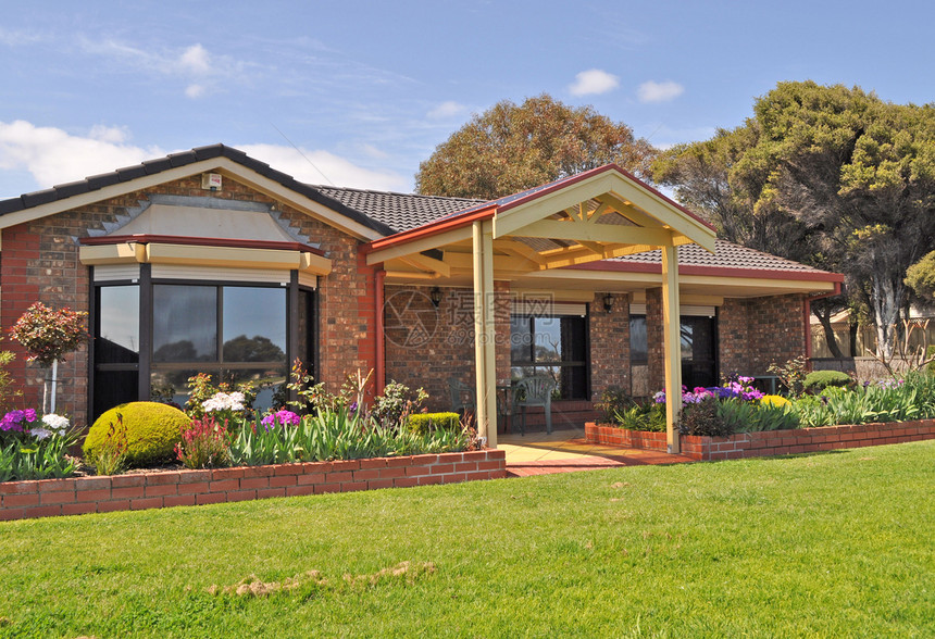 澳大利亚家庭住房 外墙外面住宅海滩财产入口园林花朵阳光晴天房子石头图片