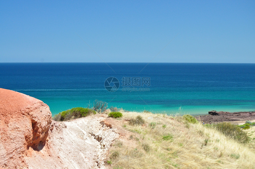 南澳大利亚州保护公园 海滨蓝色和红石阳光海岸海景爬坡假期支撑公园石头天堂植物图片