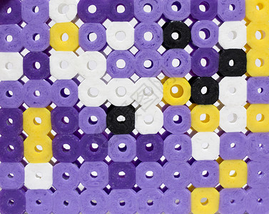 珠底背景塑料黑色白色紫色玩具珠子背景图片