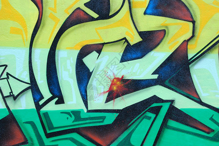 墙上彩色涂鸦的片段艺术水平活力黄色绿色街道墙纸背景图片