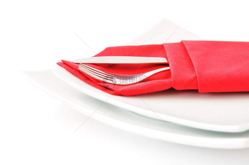 红餐巾纸上的刀叉桌布说谎金属用餐纺织品反射食物合金用具环境图片
