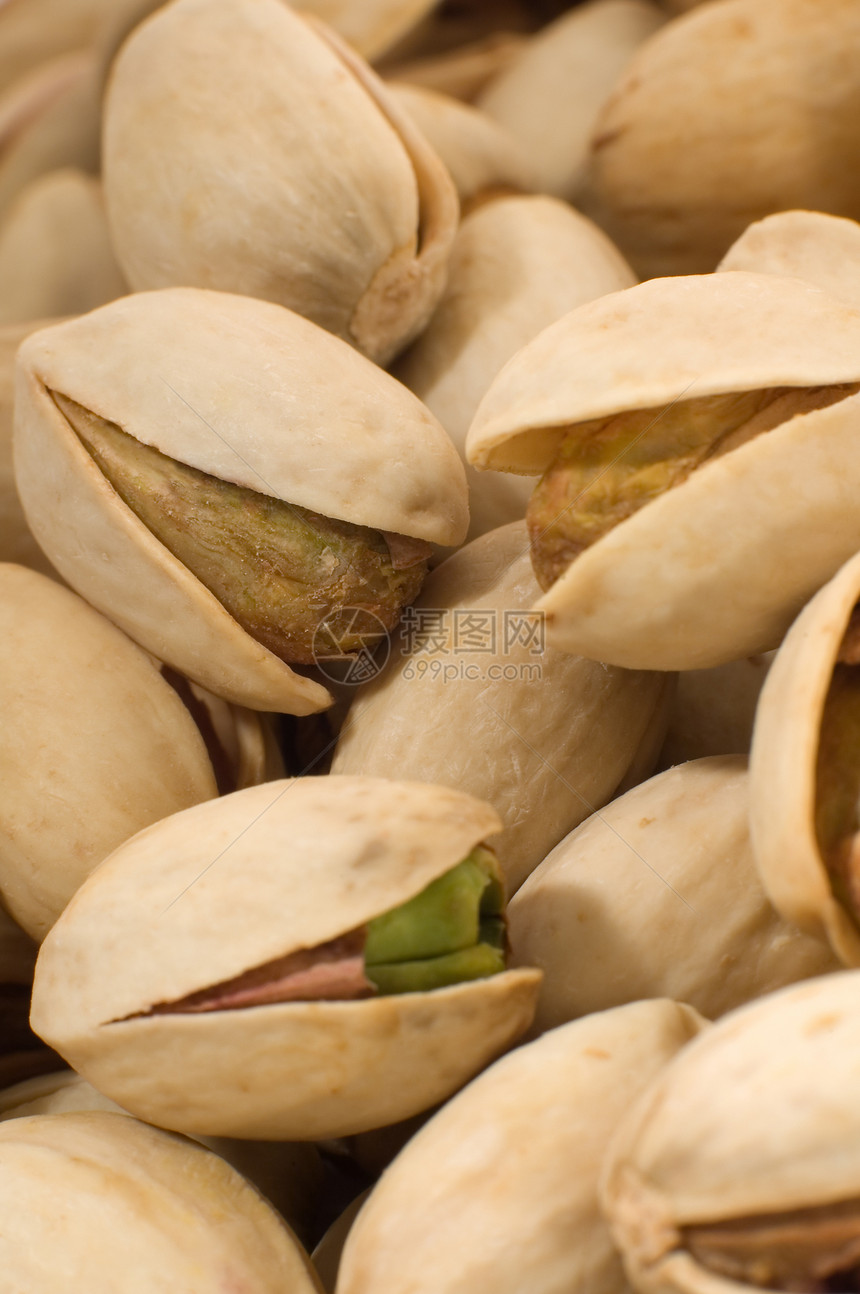 帕斯塔希奥斯棕色种子开心果饮食市场食物盐渍植物团体绿色图片